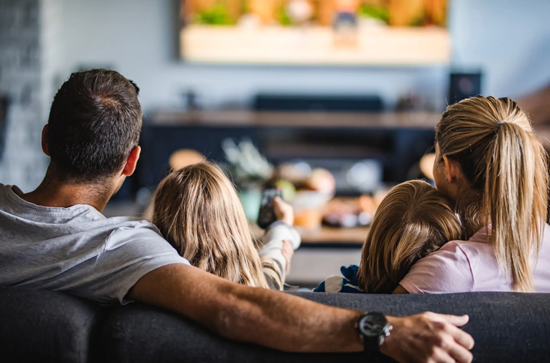 new house family watching TV